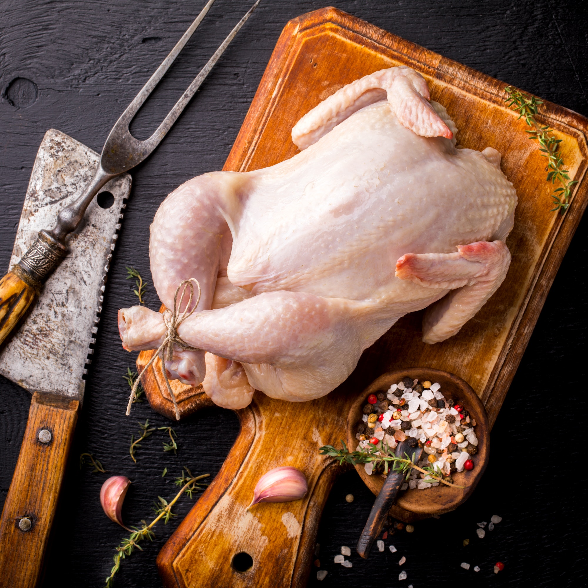 Whole Raw Chicken with Herbs and Spices .Food Ingredient Cooking Background